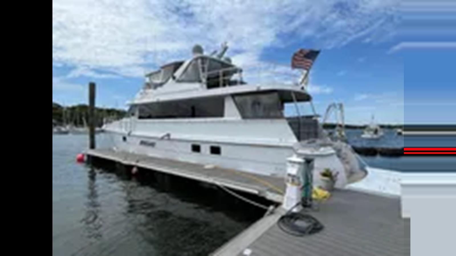 a boat on the water aboard 1999 HATTERAS 74 SPORT DECK MOTOR YACHT Yacht for Sale