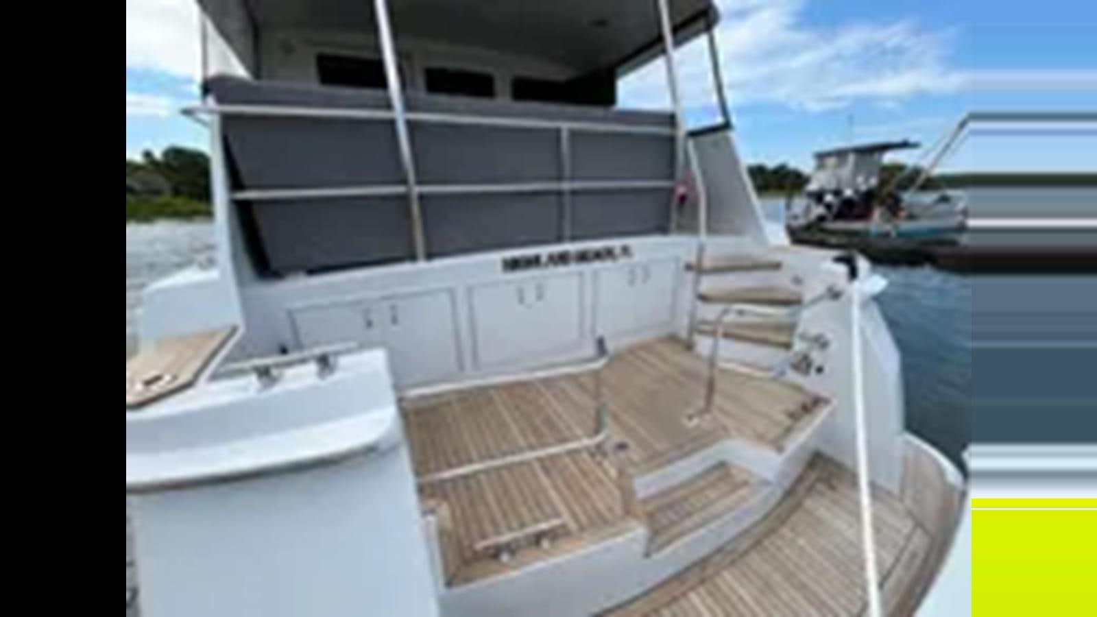a boat on the water aboard 1999 HATTERAS 74 SPORT DECK MOTOR YACHT Yacht for Sale
