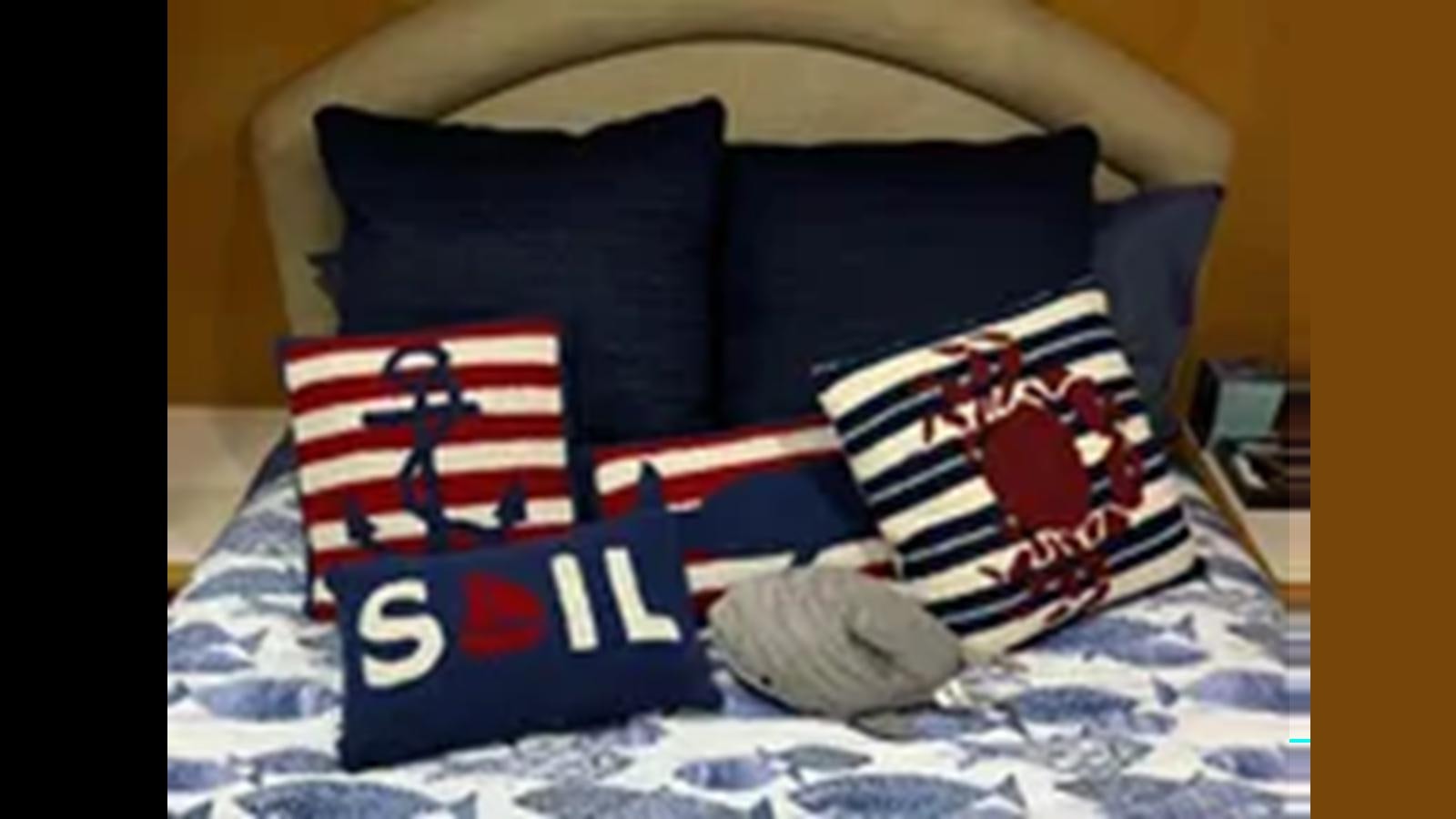 a bed with pillows aboard 1999 HATTERAS 74 SPORT DECK MOTOR YACHT Yacht for Sale