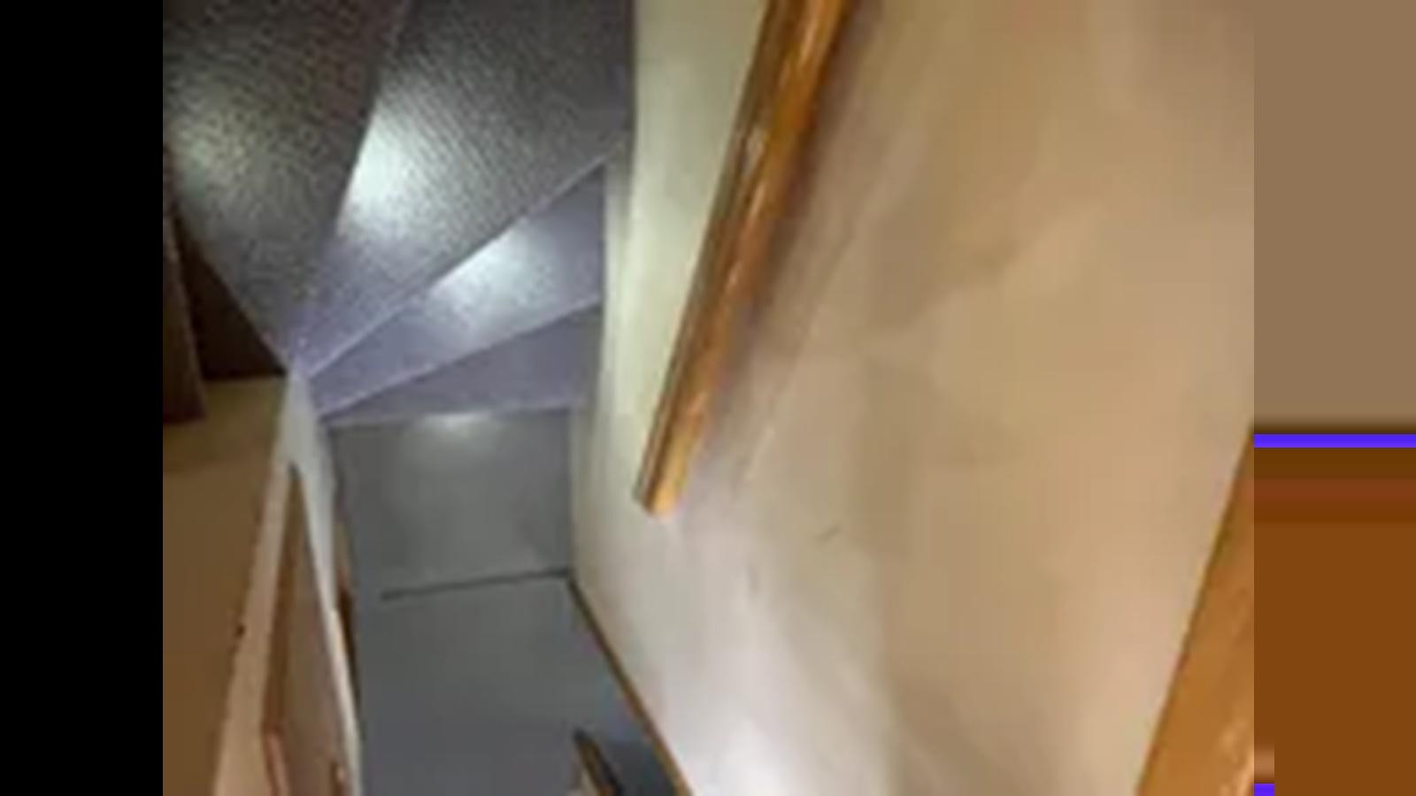 a close-up of some stairs aboard 1999 HATTERAS 74 SPORT DECK MOTOR YACHT Yacht for Sale