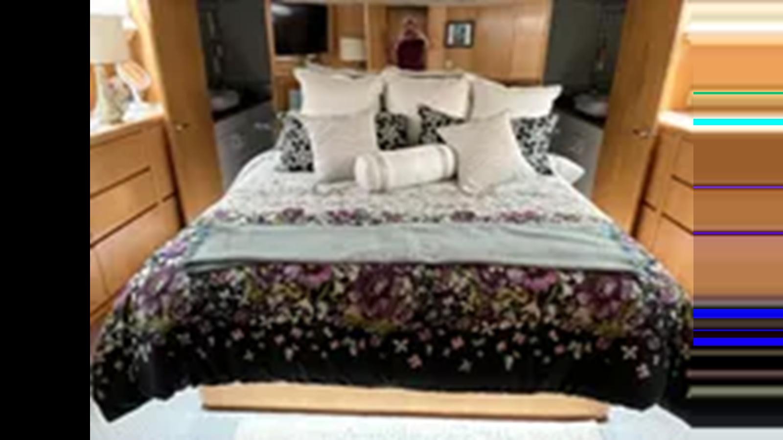 a bed with white sheets aboard 1999 HATTERAS 74 SPORT DECK MOTOR YACHT Yacht for Sale