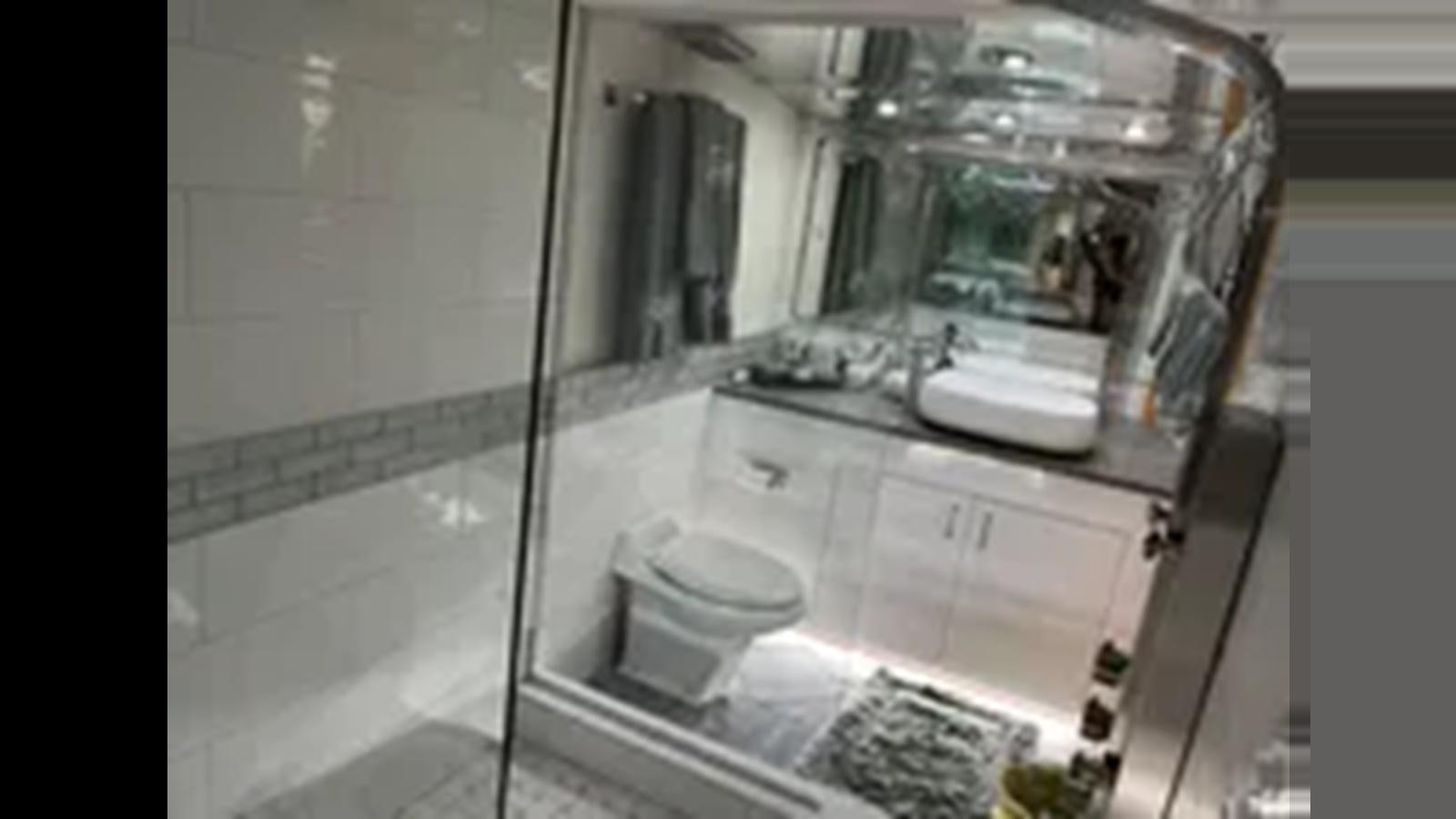 a toilet in a bathroom aboard 1999 HATTERAS 74 SPORT DECK MOTOR YACHT Yacht for Sale