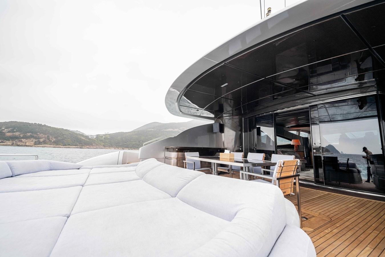 a room with a bed and a large building with a glass ceiling aboard GAMMA Yacht for Sale