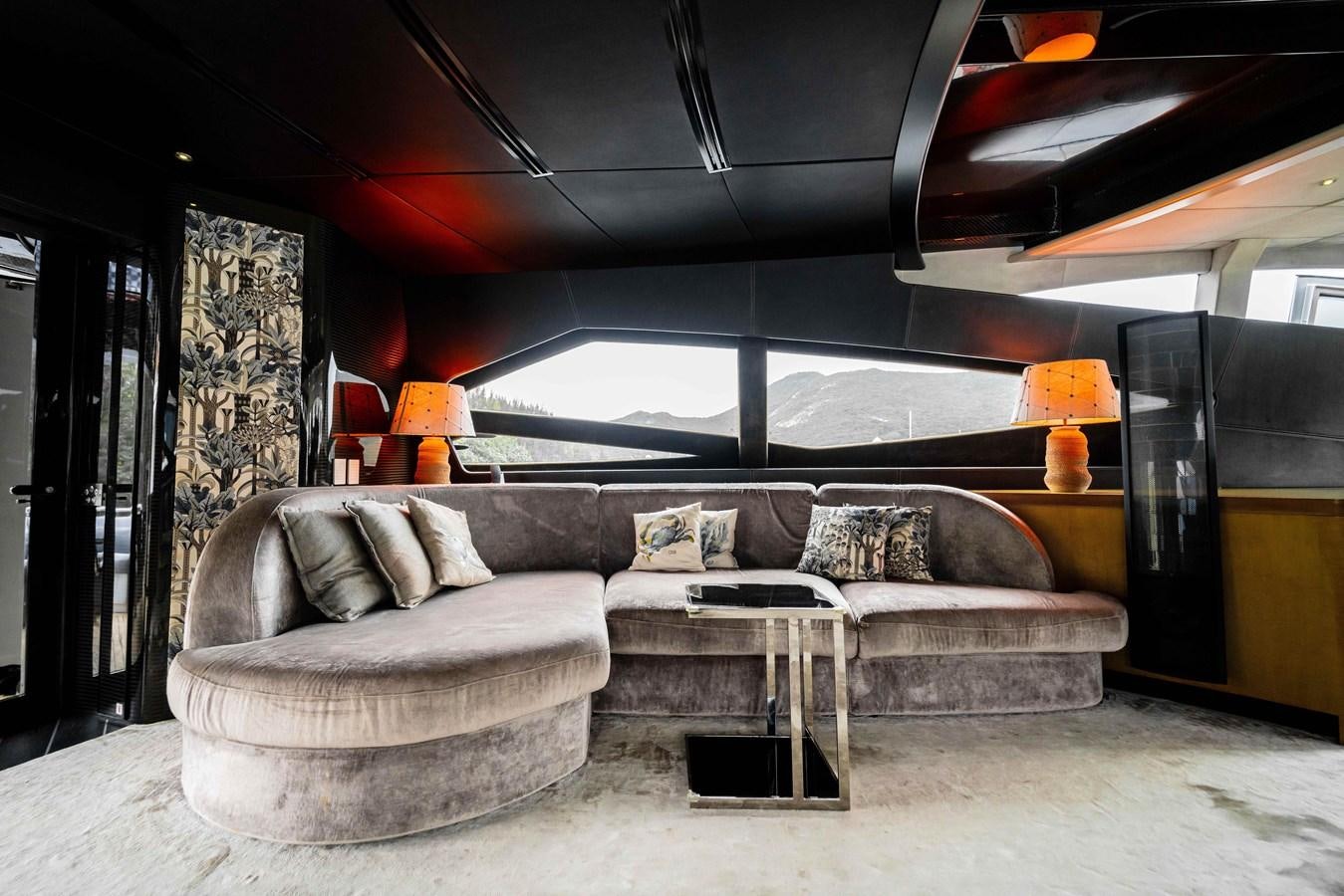 a living room with a large window aboard GAMMA Yacht for Sale