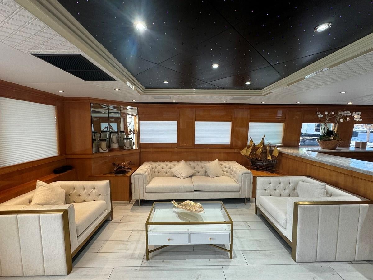 a living room with a large ceiling aboard BAGLIETTO 116 Yacht for Sale