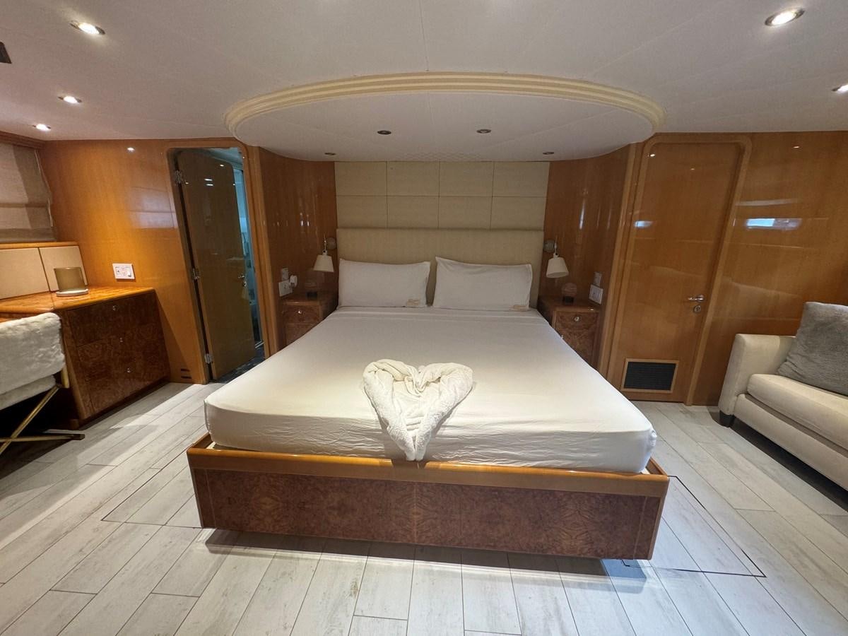 a bed in a hotel room aboard BAGLIETTO 116 Yacht for Sale