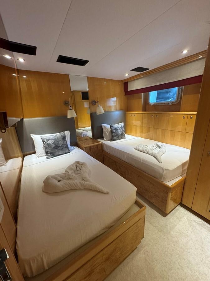 a room with two beds aboard BAGLIETTO 116 Yacht for Sale