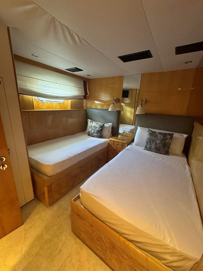 a room with two beds aboard BAGLIETTO 116 Yacht for Sale