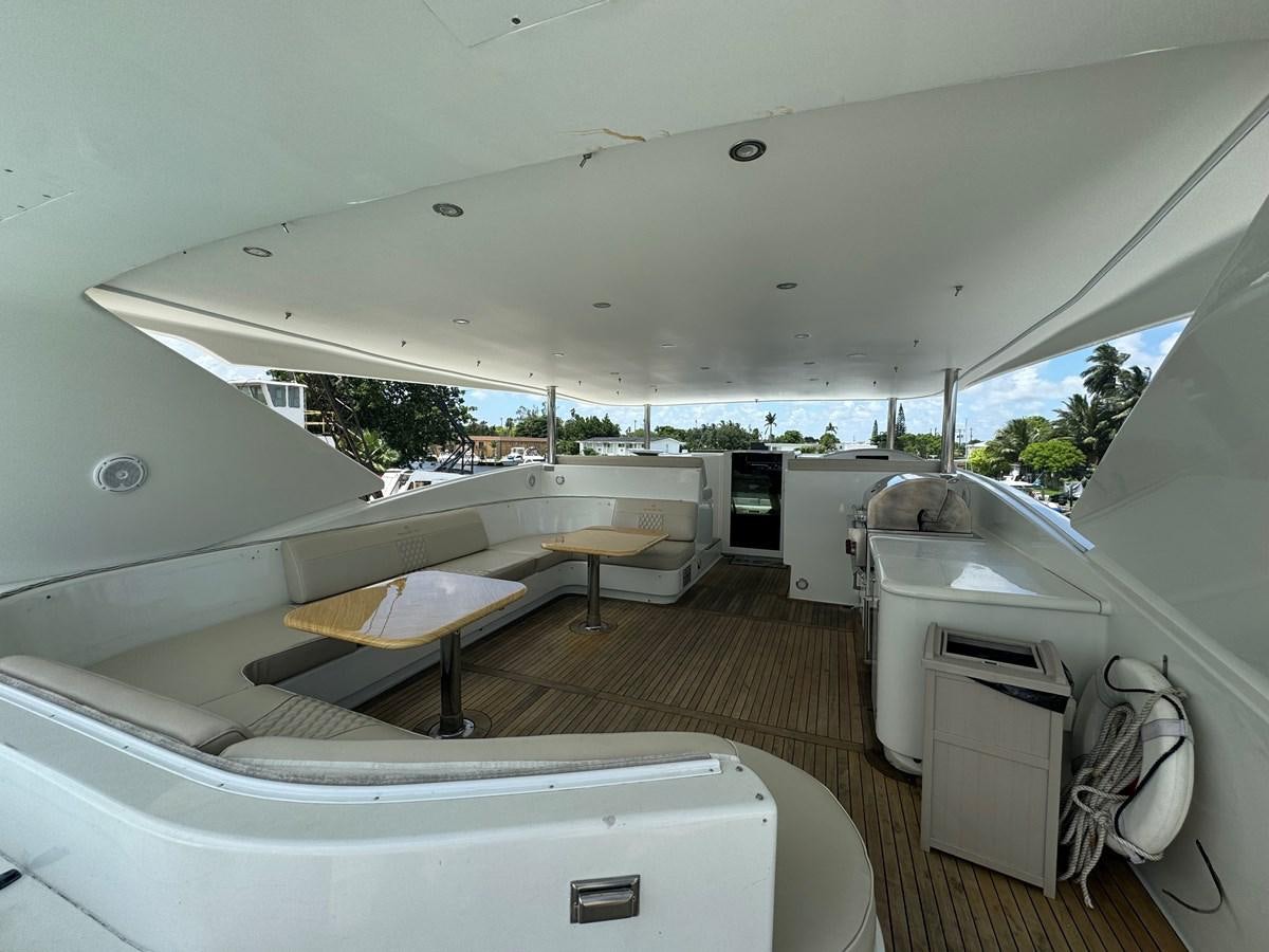 a room with a bed and a sink aboard BAGLIETTO 116 Yacht for Sale