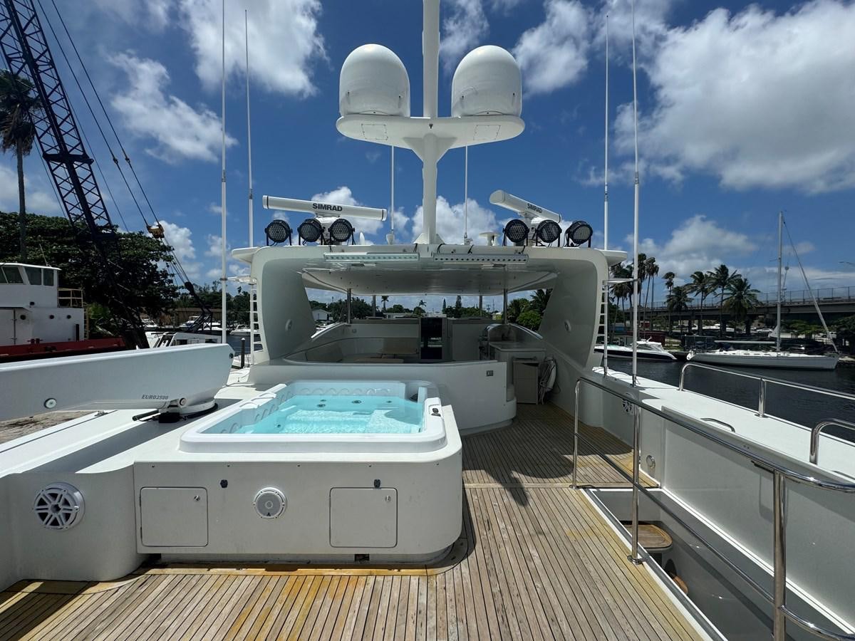 a deck with a large white boat and a large white fan on it aboard BAGLIETTO 116 Yacht for Sale