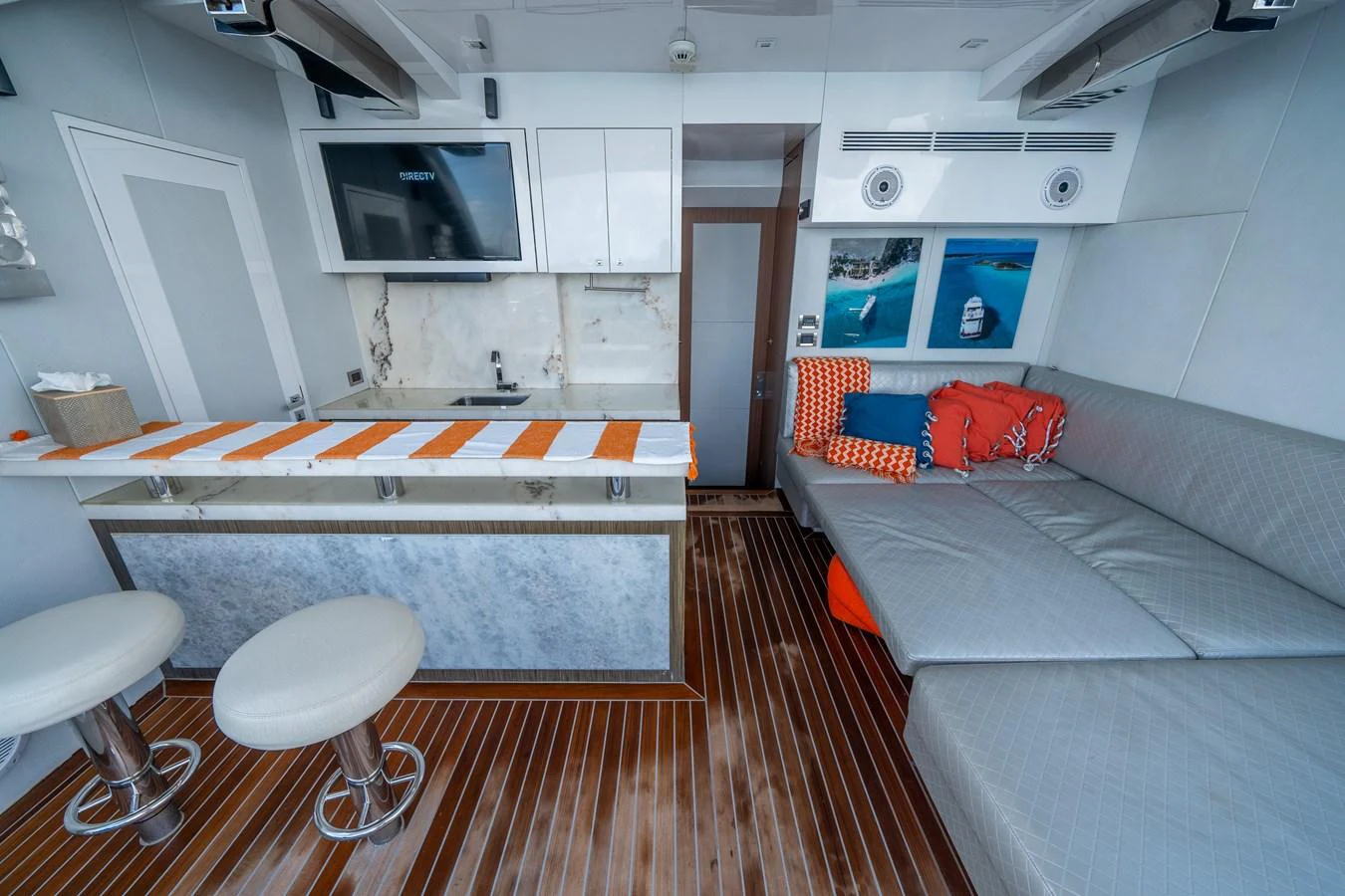 a room with a bed and a couch aboard DAY ONE Yacht for Sale