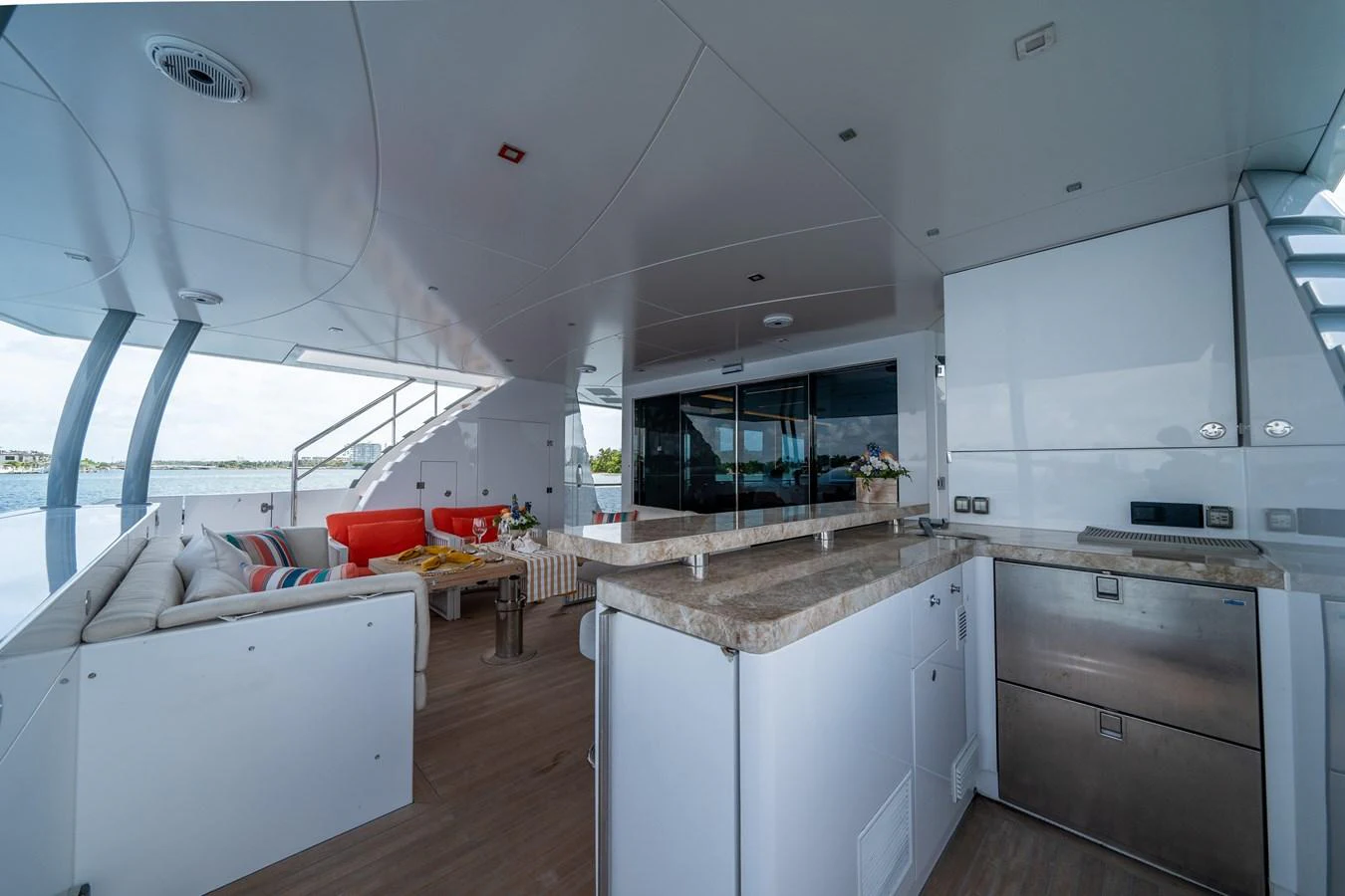 a kitchen with white cabinets aboard DAY ONE Yacht for Sale