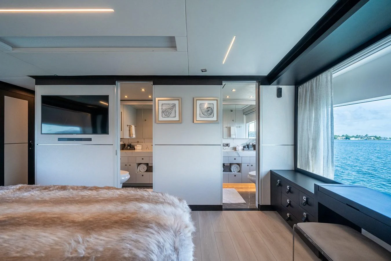 a room with a bed and a desk aboard DAY ONE Yacht for Sale
