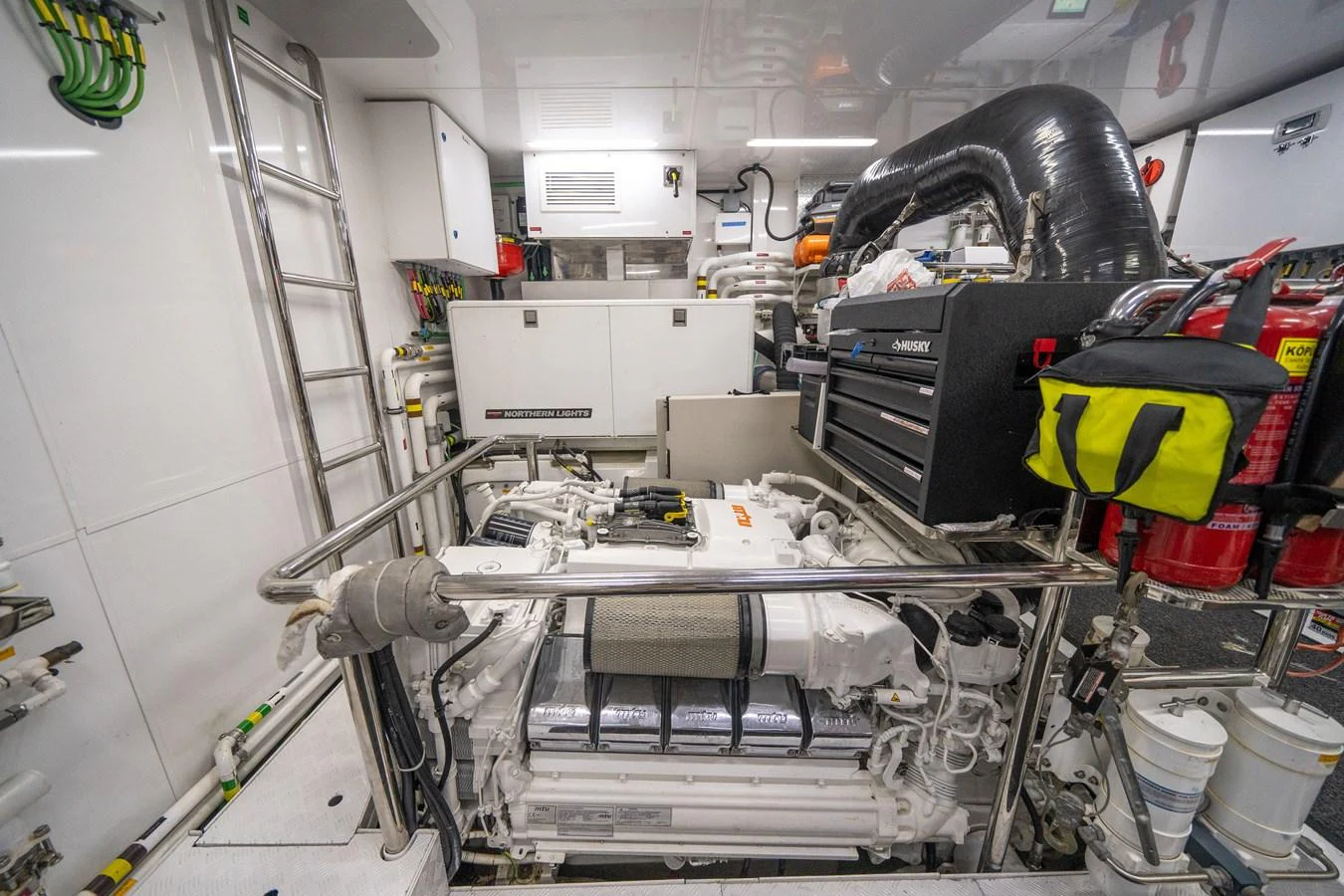 a car with a large engine aboard DAY ONE Yacht for Sale