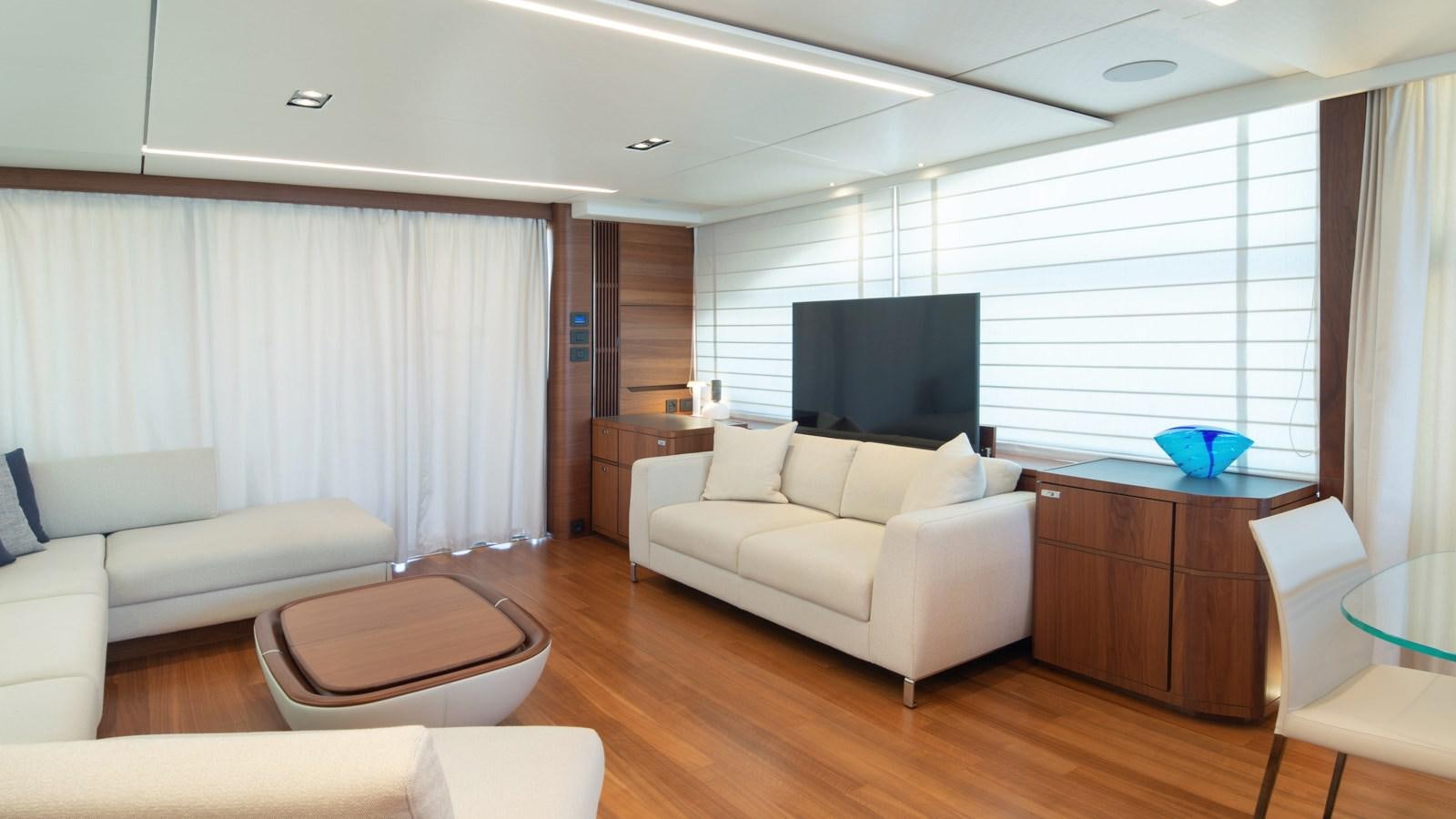 a living room with a large television aboard SERENATA Yacht for Sale