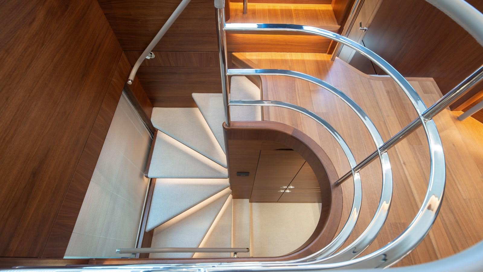 a spiral staircase in a building aboard SERENATA Yacht for Sale