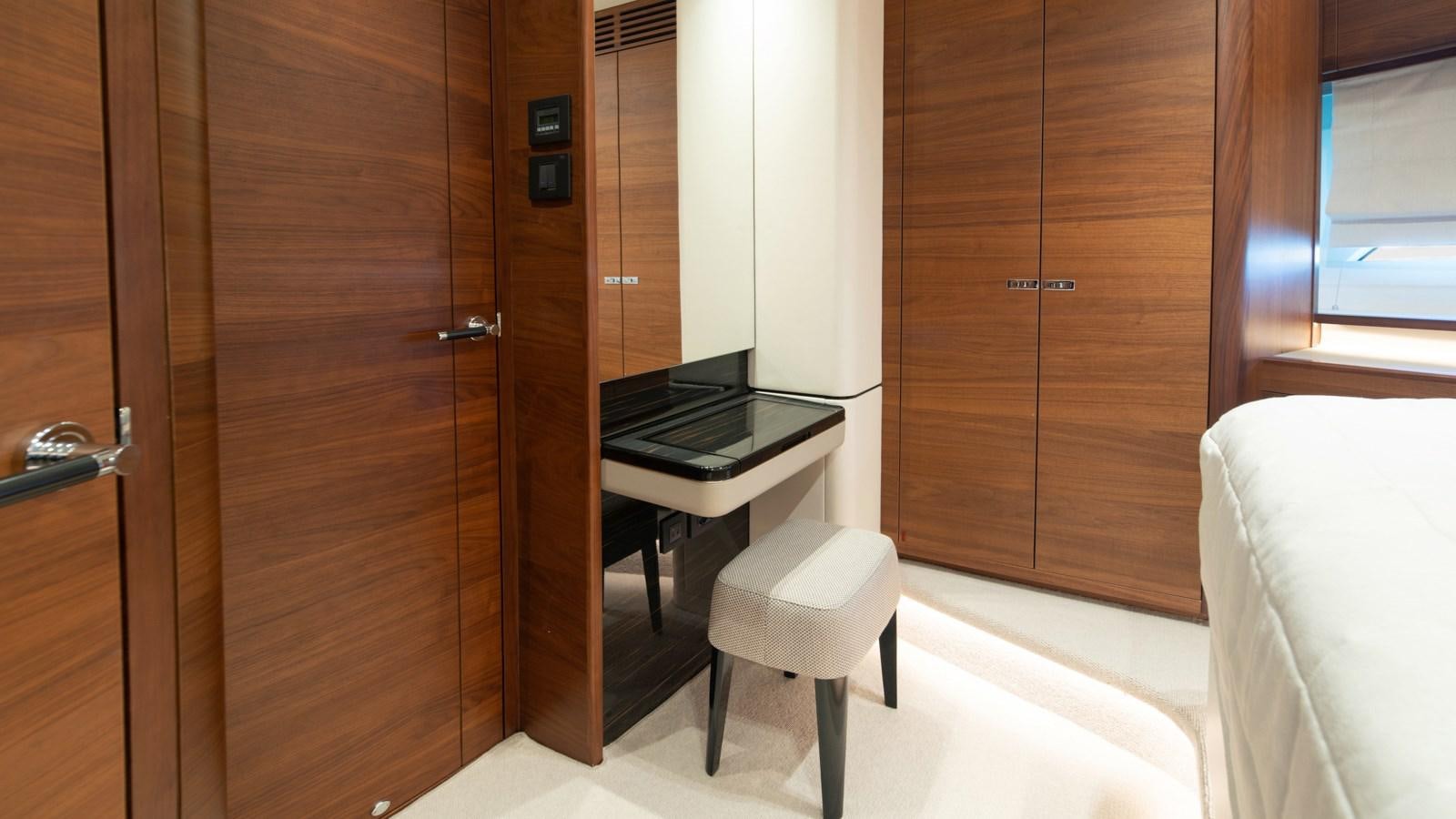 a room with a desk and a bed aboard SERENATA Yacht for Sale