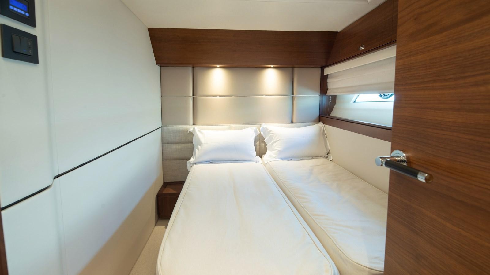 a room with two beds aboard SERENATA Yacht for Sale
