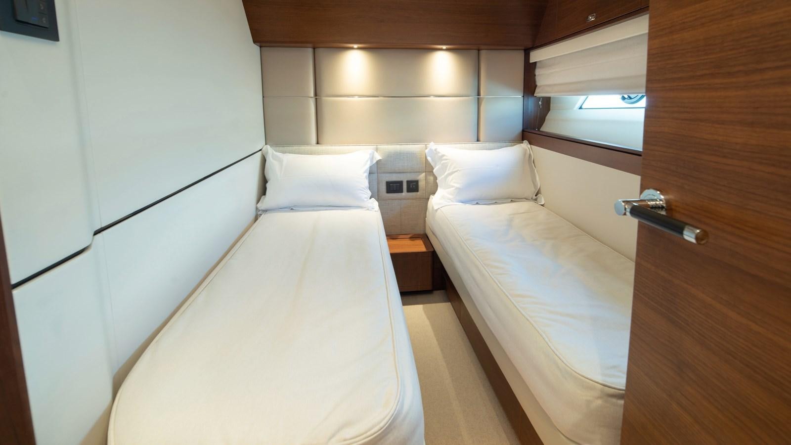 a room with two beds aboard SERENATA Yacht for Sale