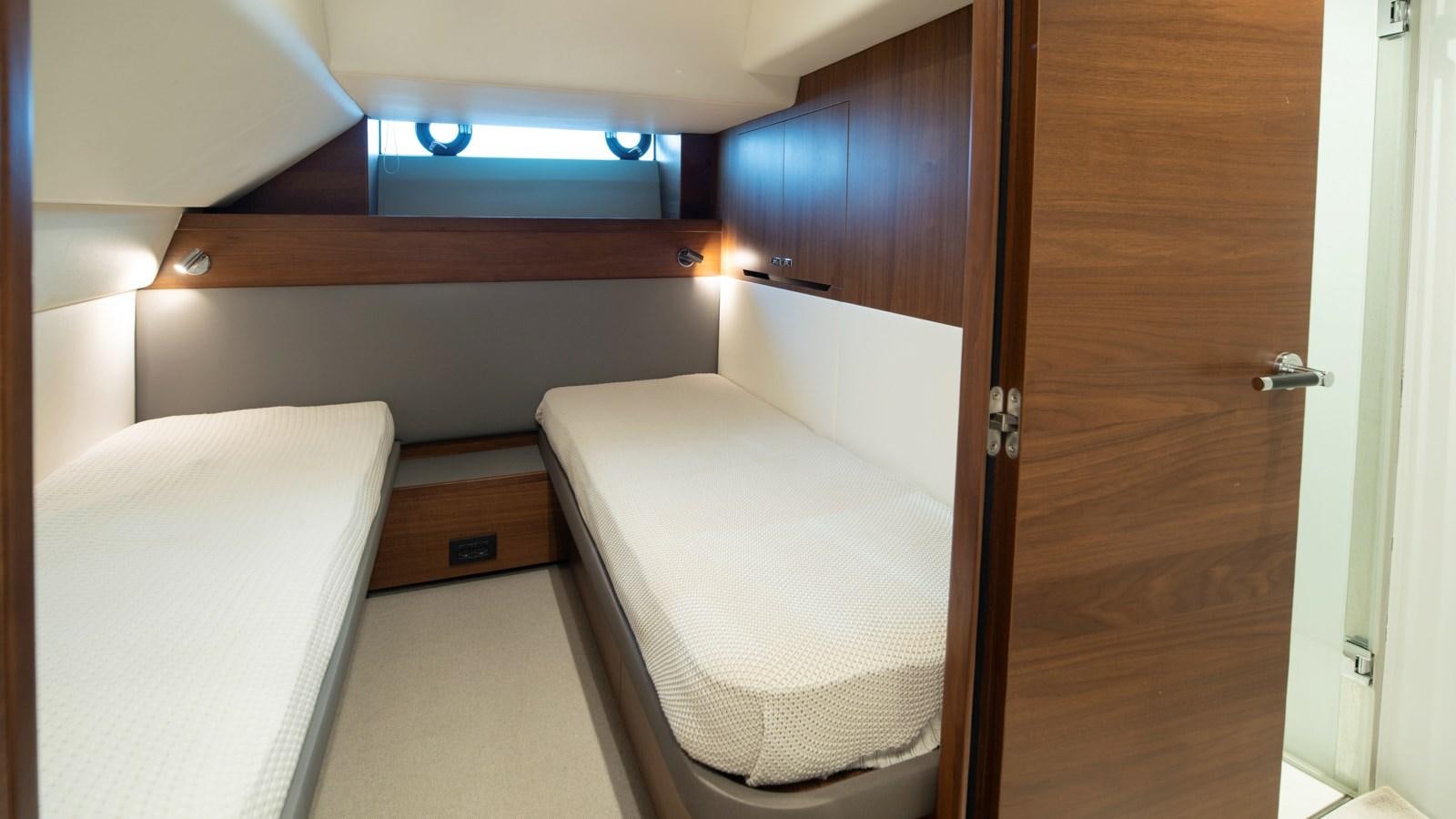 a room with a bed and a closet aboard SERENATA Yacht for Sale