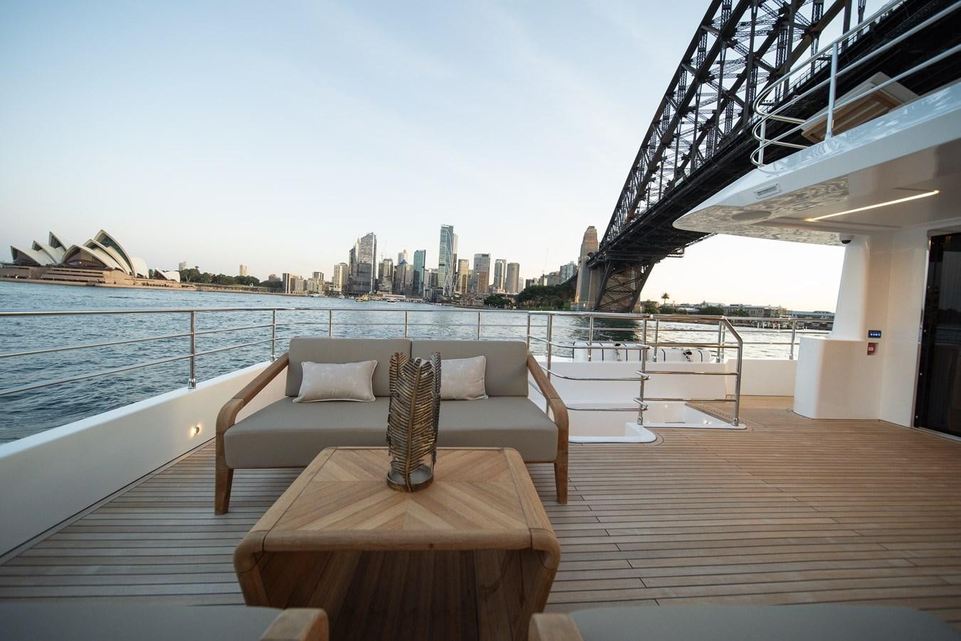 a large balcony overlooking a city aboard BLUESTONE Yacht for Sale