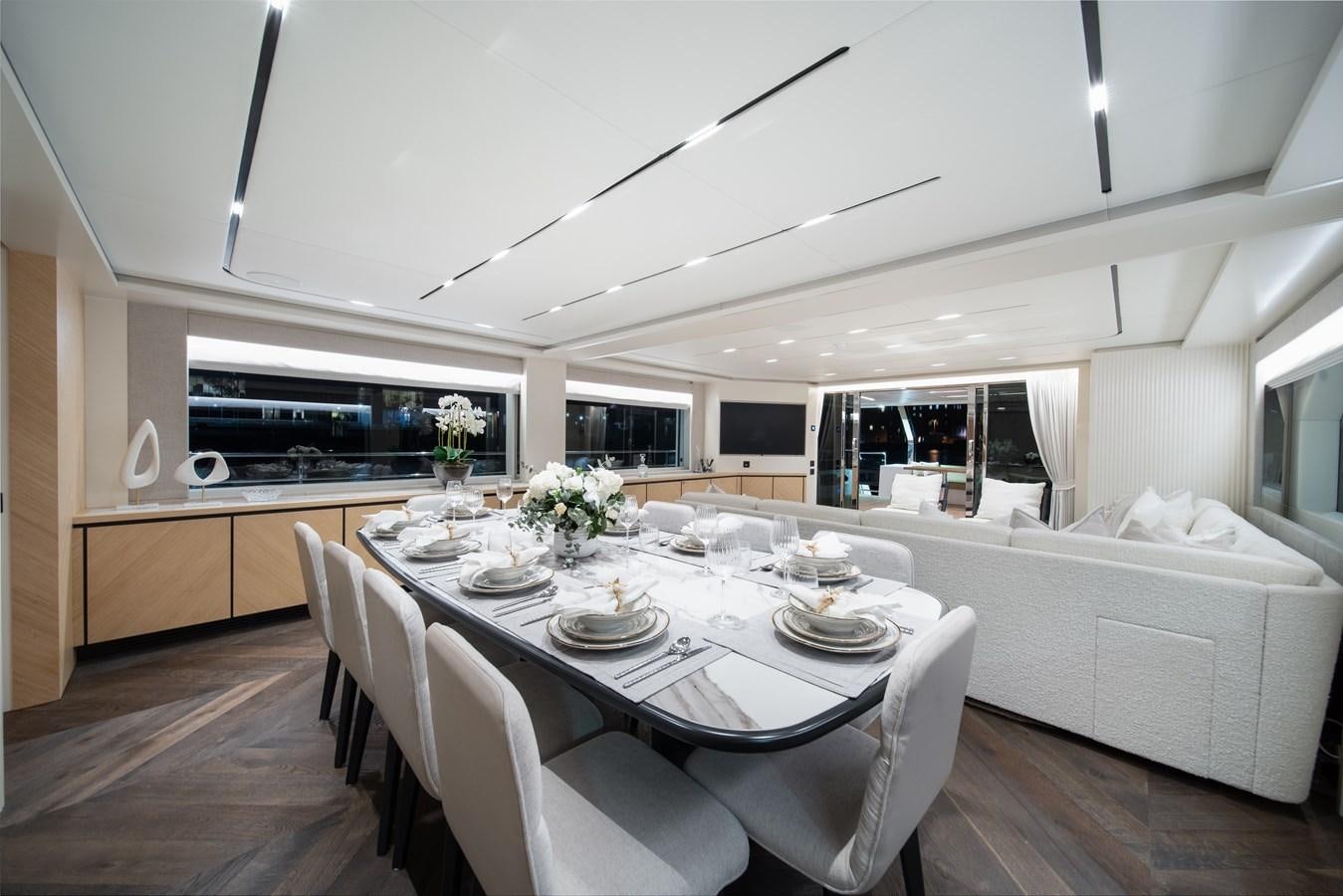 a kitchen with a dining table aboard BLUESTONE Yacht for Sale
