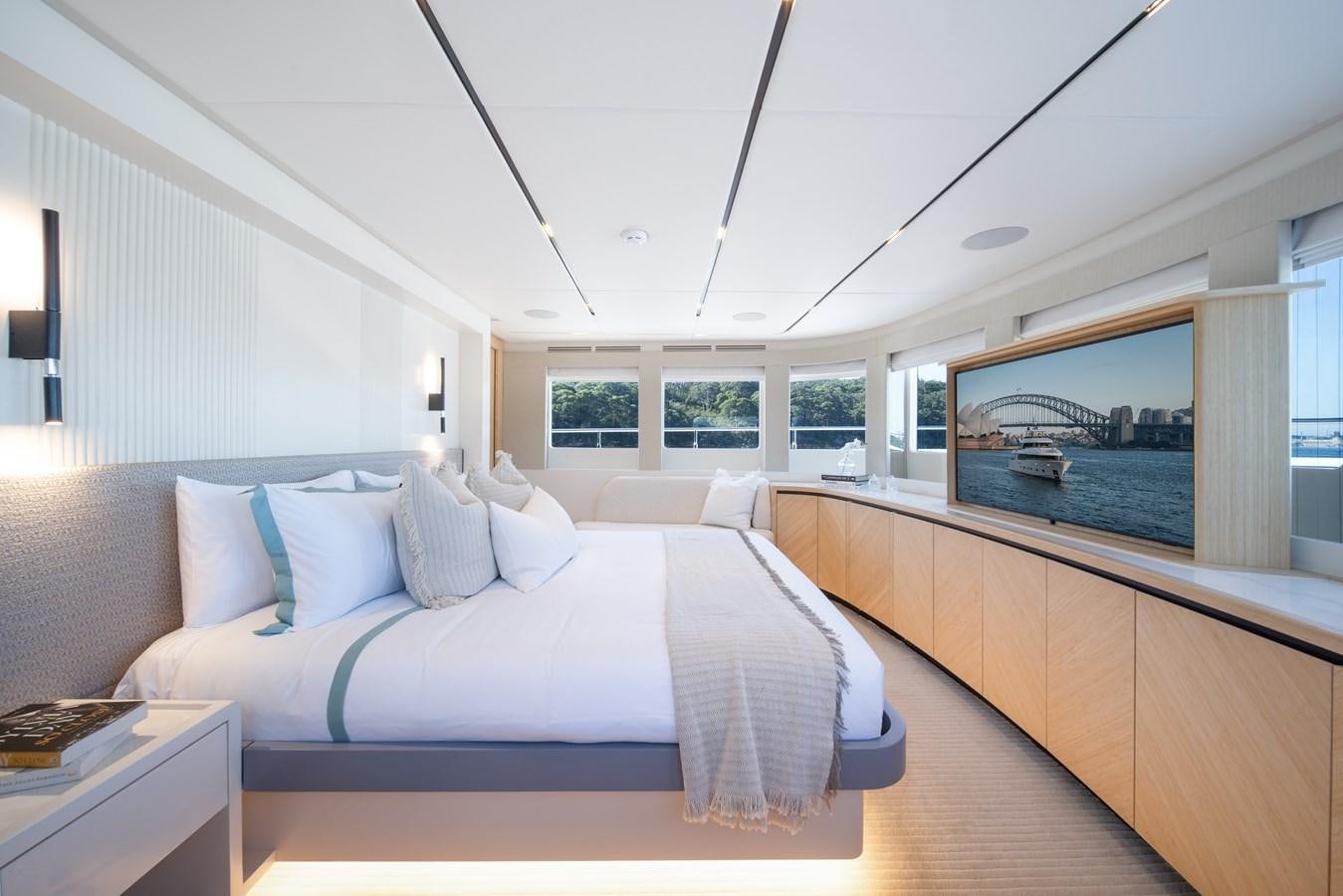 a bedroom with a large bed aboard BLUESTONE Yacht for Sale