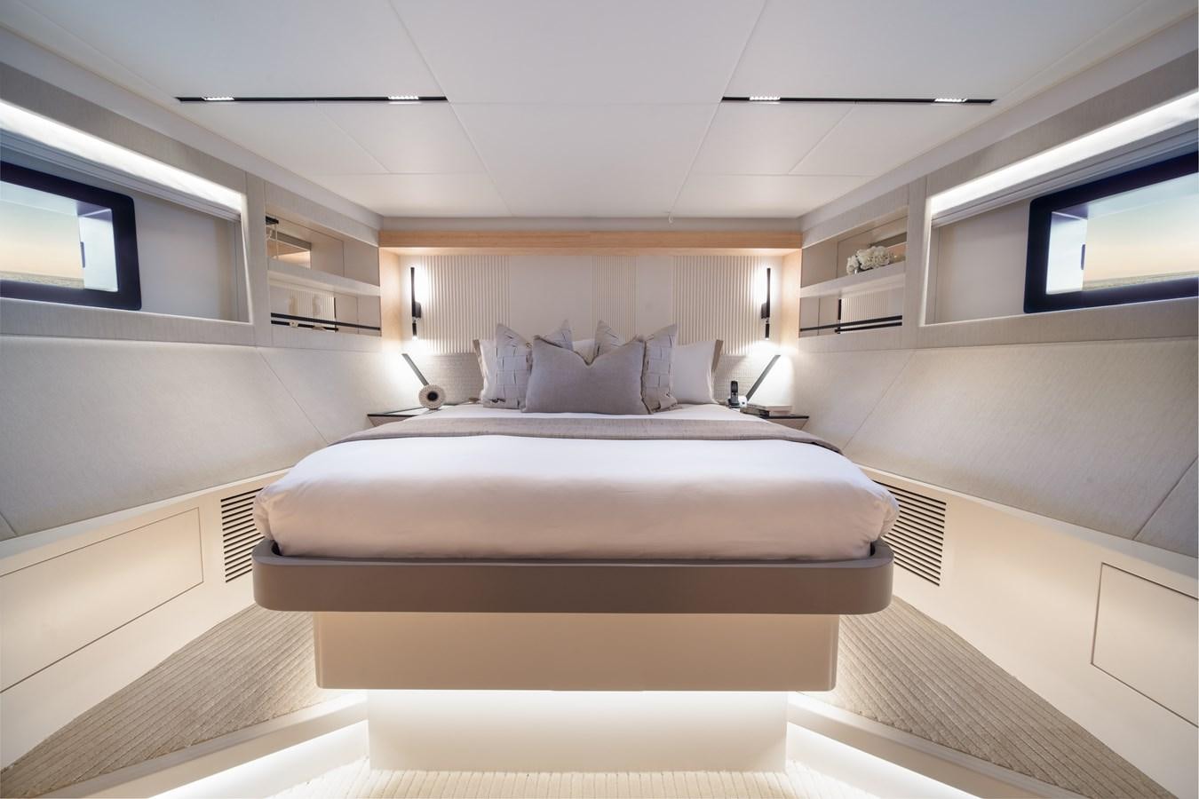 a room with a bed and a window aboard BLUESTONE Yacht for Sale