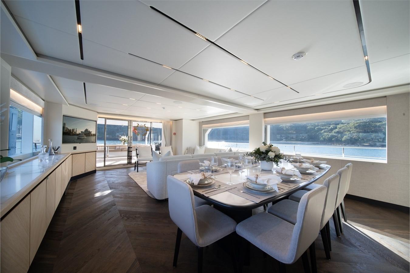 a large kitchen with a dining table aboard BLUESTONE Yacht for Sale