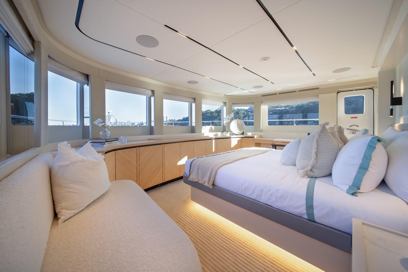 a room with a bed and a couch aboard BLUESTONE Yacht for Sale