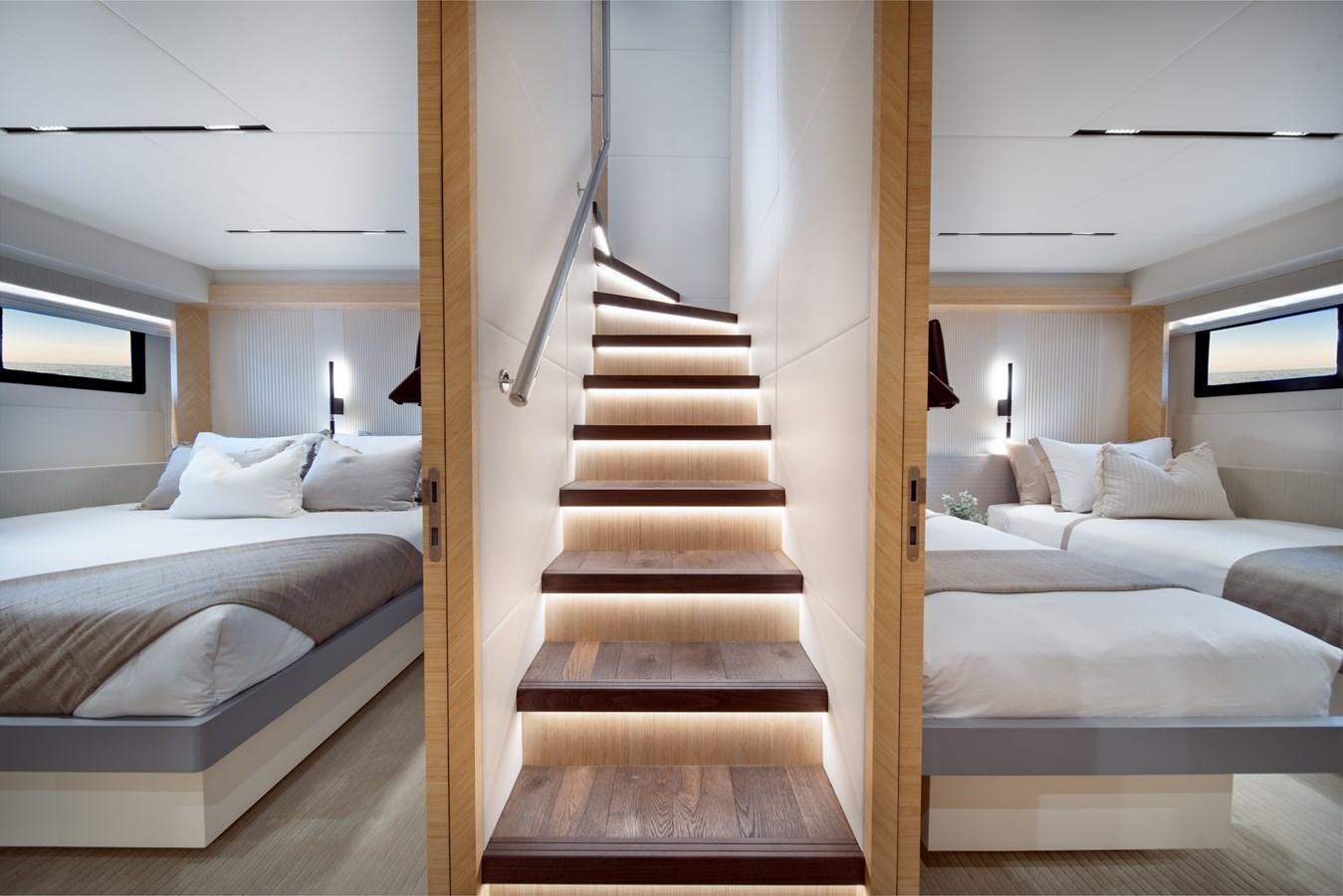 a room with a bed and a staircase aboard BLUESTONE Yacht for Sale