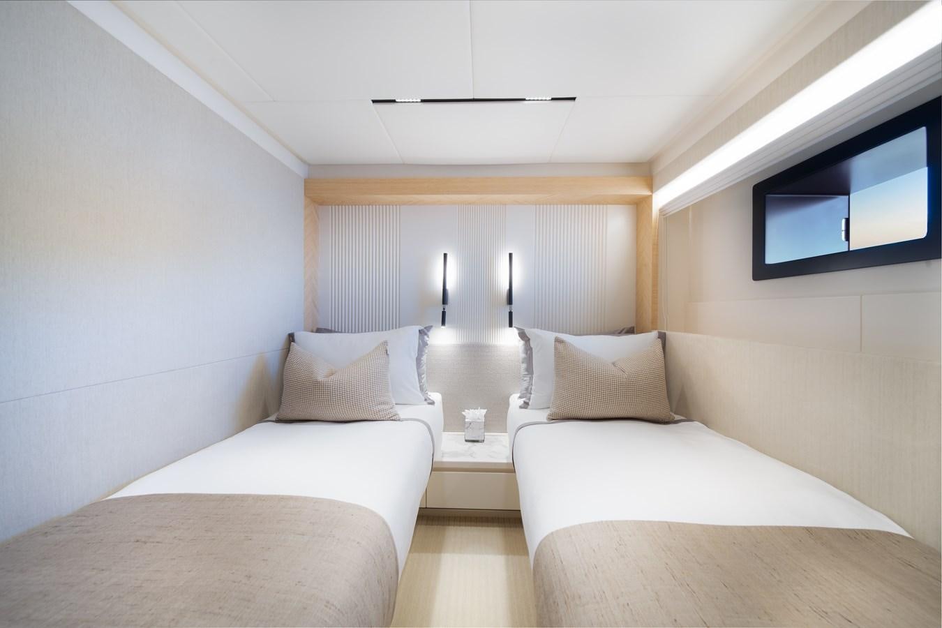 a room with two beds aboard BLUESTONE Yacht for Sale