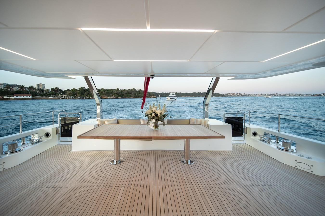 a table on a deck aboard BLUESTONE Yacht for Sale