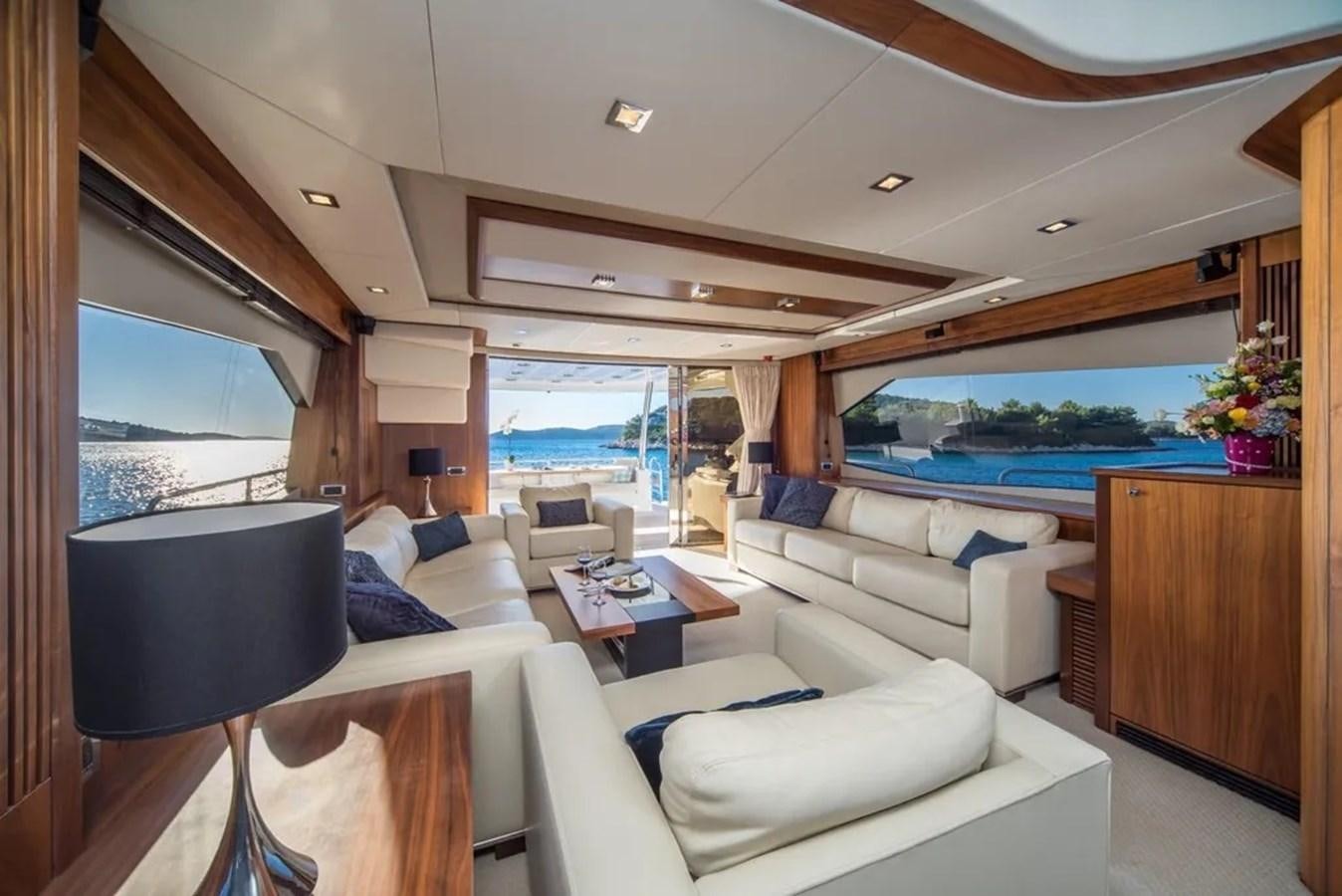 a room with a couch and a pool aboard SUNSEEKER 84 Yacht for Sale
