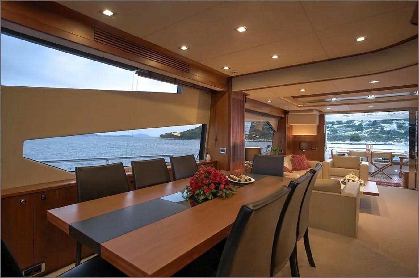 a room with a table and chairs aboard SUNSEEKER 84 Yacht for Sale