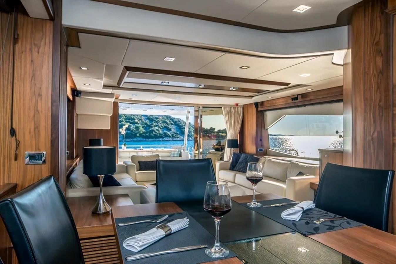 a room with a table chairs and a window aboard SUNSEEKER 84 Yacht for Sale
