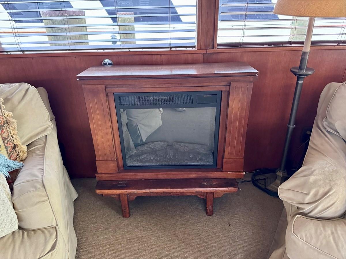 a fireplace in a room aboard BRAVEHEART Yacht for Sale