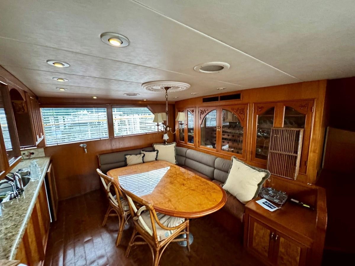 a living room with a couch and a table aboard BRAVEHEART Yacht for Sale