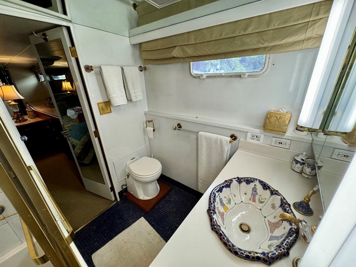a bathroom with a sink toilet and a bathtub aboard BRAVEHEART Yacht for Sale