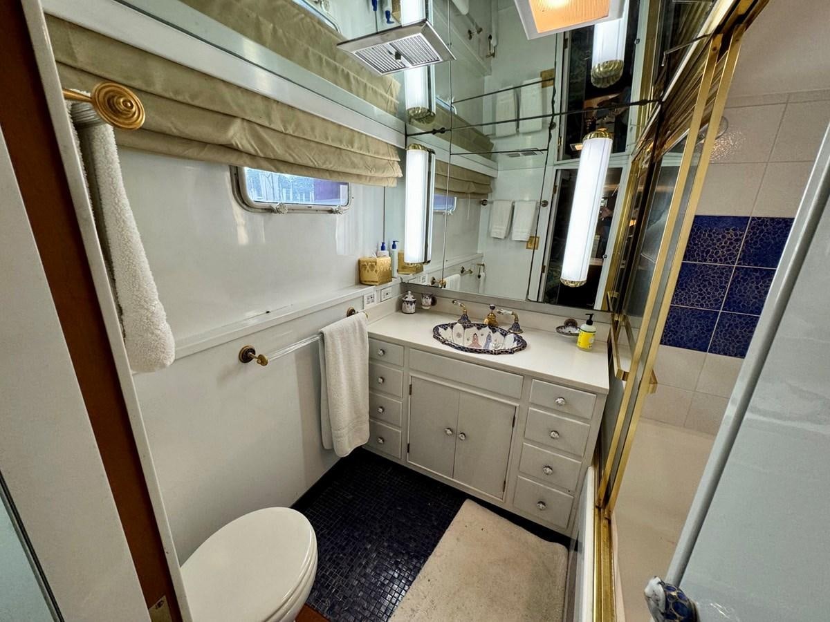 a bathroom with a sink and toilet aboard BRAVEHEART Yacht for Sale