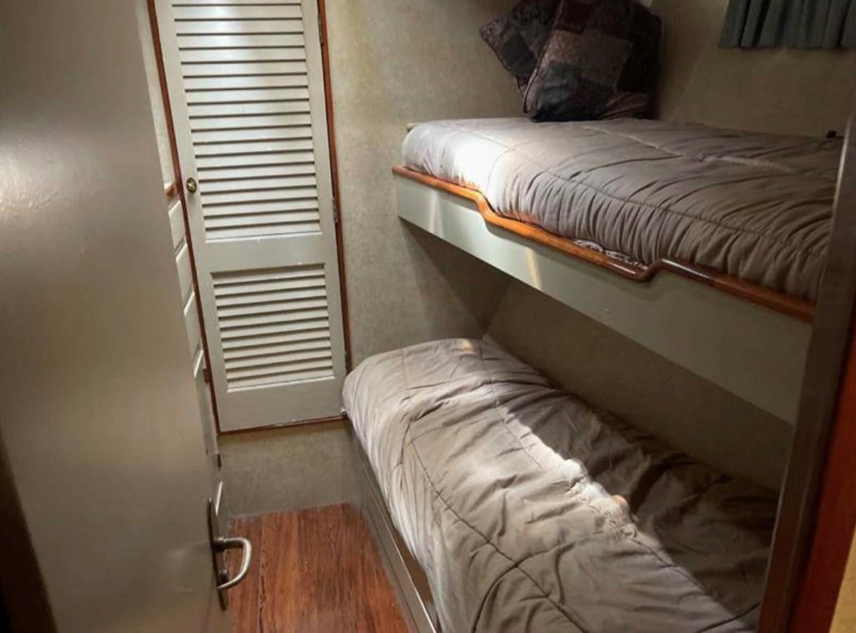a room with two beds aboard BRAVEHEART Yacht for Sale