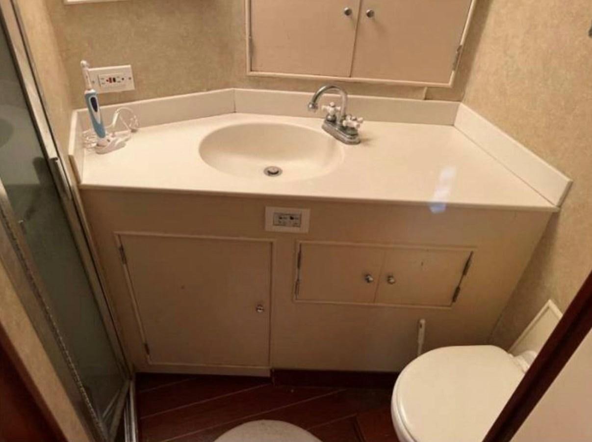 a bathroom with a sink and toilet aboard BRAVEHEART Yacht for Sale