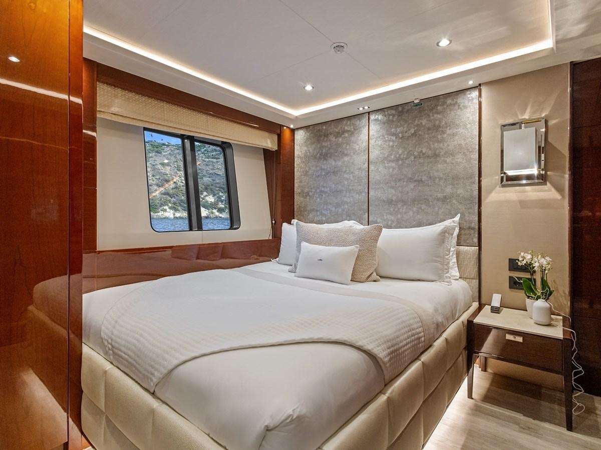 a bed with a white bed aboard ACE 2 Yacht for Sale
