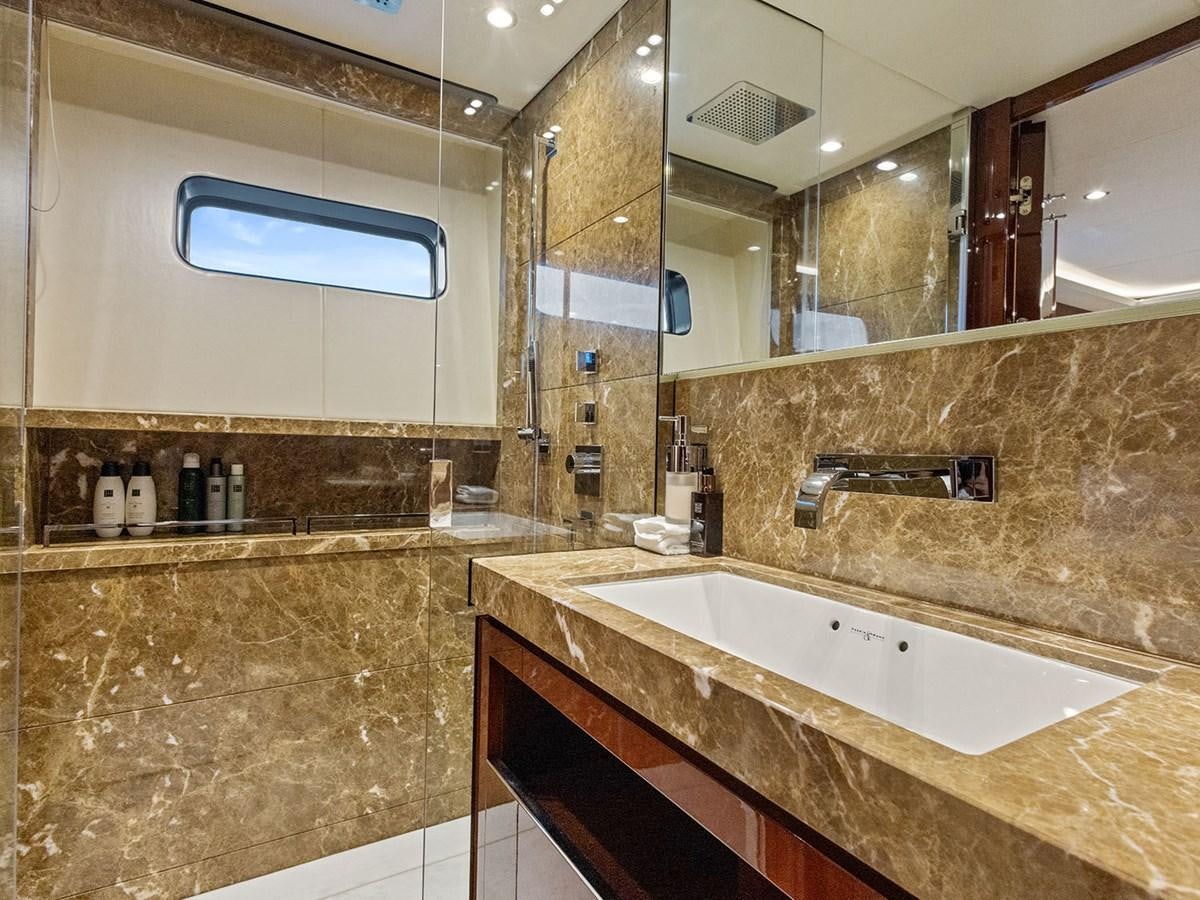 a bathroom with a large mirror aboard ACE 2 Yacht for Sale