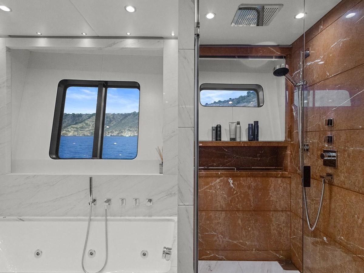 a room with a wood door and a window aboard ACE 2 Yacht for Sale