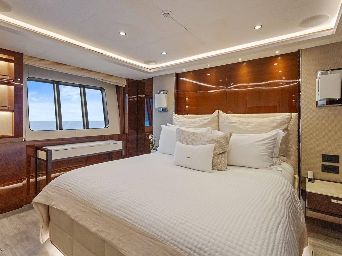a bed with white sheets aboard ACE 2 Yacht for Sale
