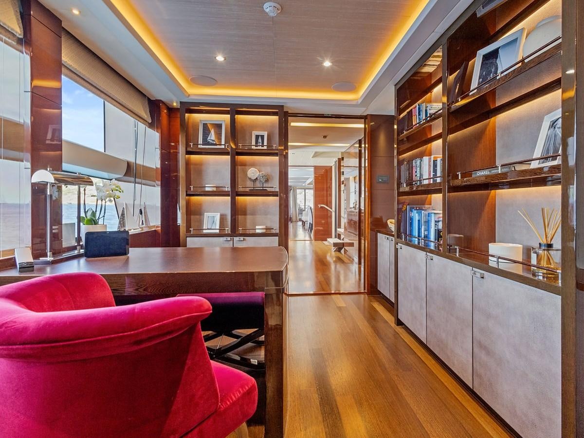 a room with a table and chairs aboard ACE 2 Yacht for Sale