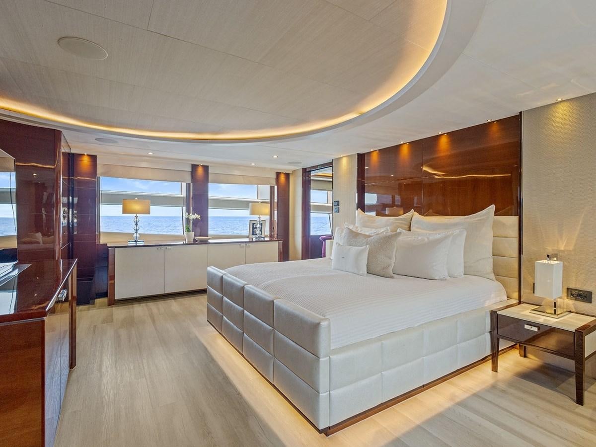 a large bedroom with a large bed aboard ACE 2 Yacht for Sale