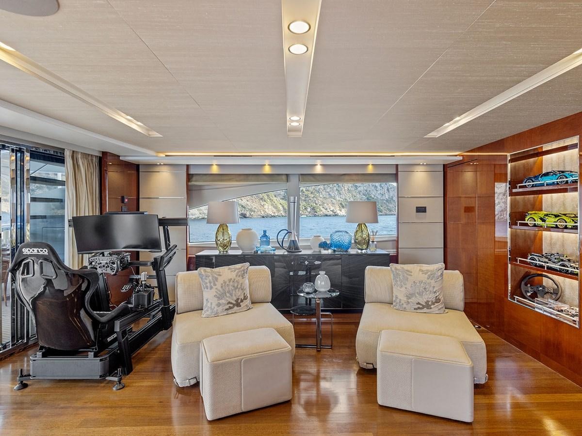 a living room with a piano and a piano aboard ACE 2 Yacht for Sale