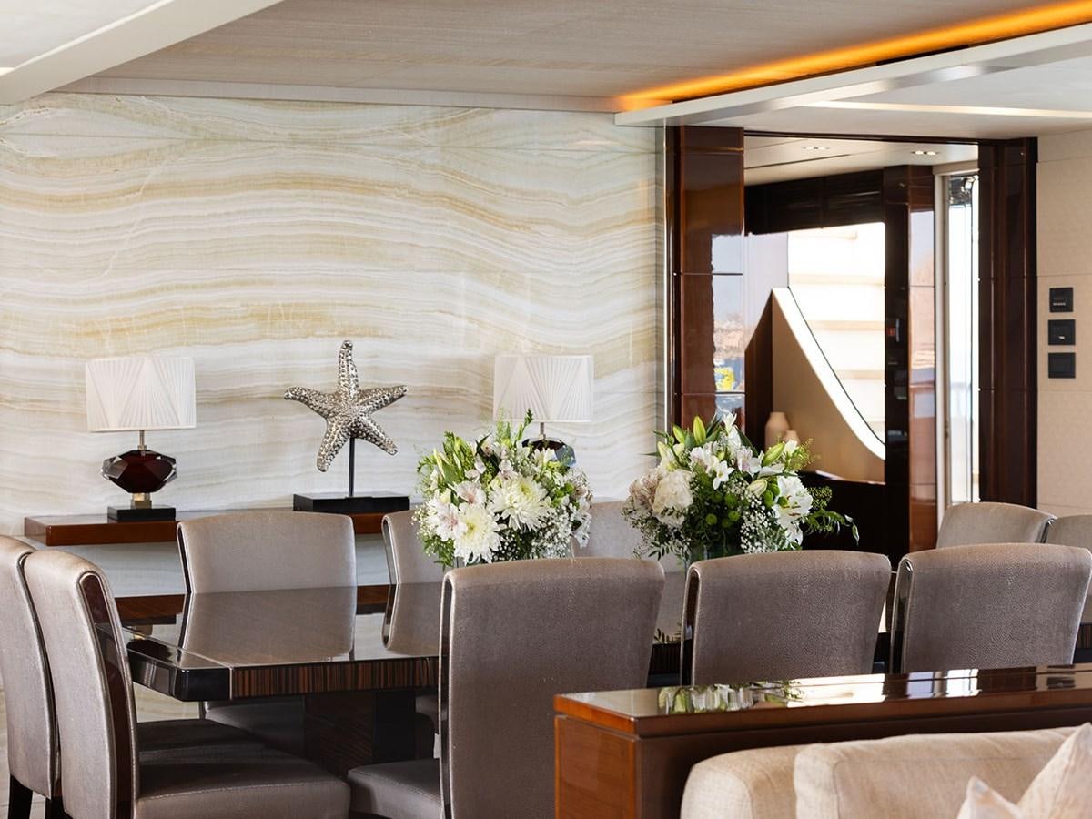 a room with chairs and a table aboard ACE 2 Yacht for Sale